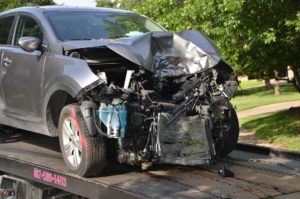 totaled gray vehicle after front end collision