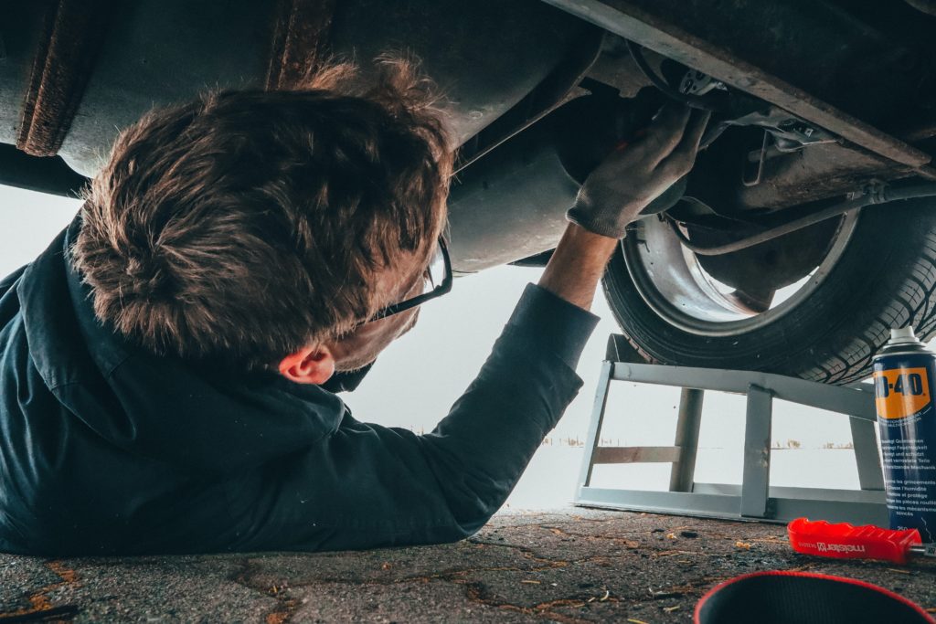 mechanic making repairs after recommendation from a vehicle property damage lawyer