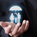 Family under an umbrella held by attorney for life insurance