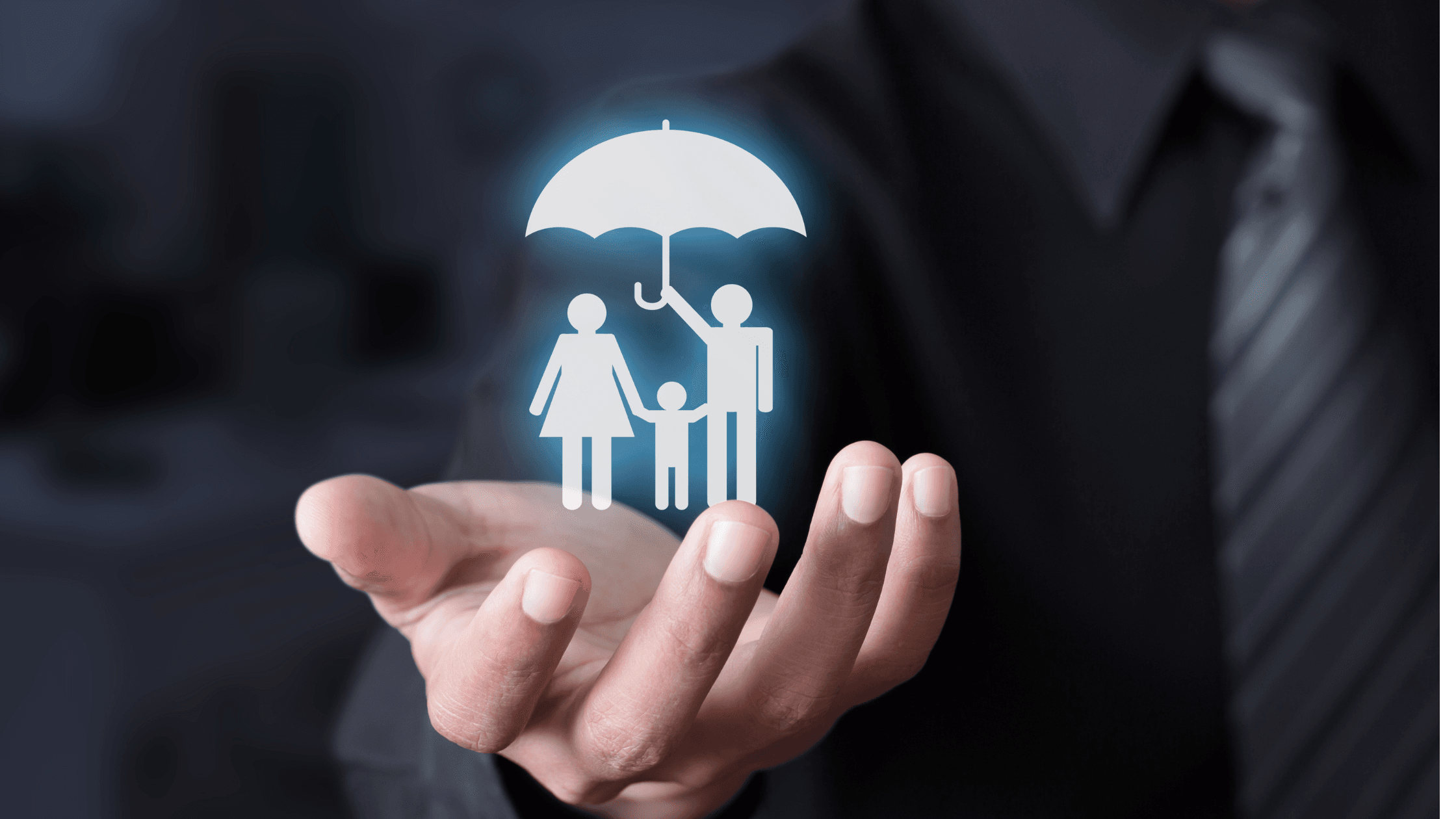 Family under an umbrella held by attorney for life insurance