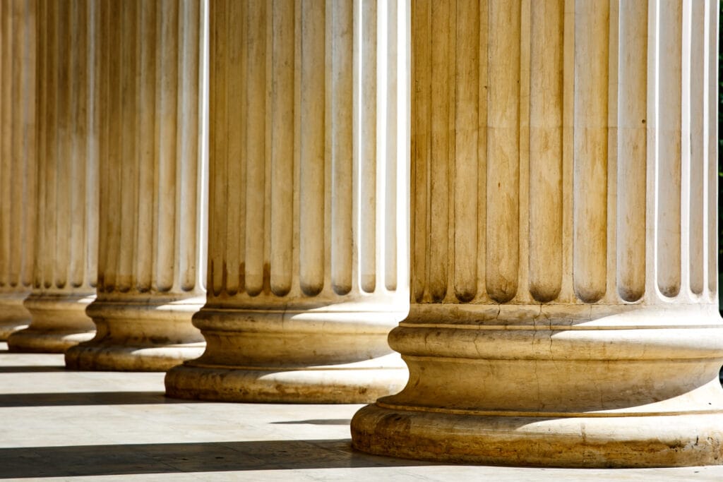 Columns with base and flute on a sun light