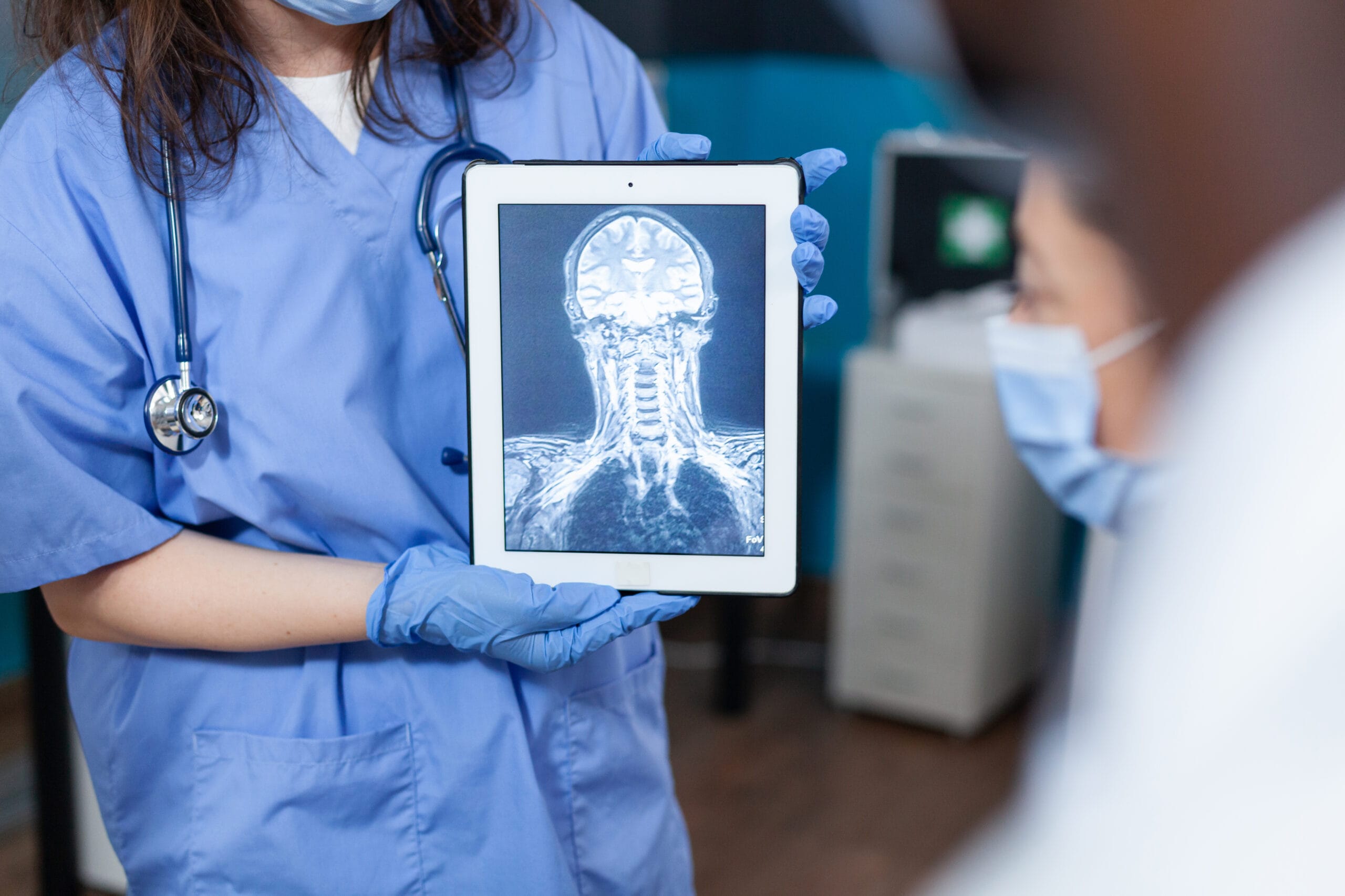 Doctor holding brain scan